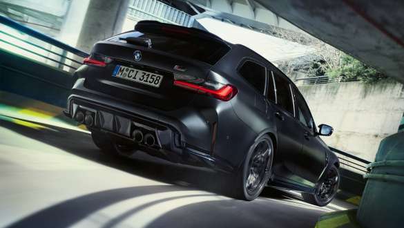 M-specific suspension BMW M3 Competition Touring G81 BMW M3 Competition Touring G81 BMW Individual Frozen Black metallic M-specific suspension Three-quarter rear view driving