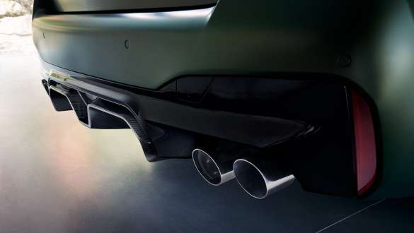 M Sport exhaust system BMW M5 CS F90 2021 M Sport exhaust system BMW M5 CS F90 2021 Frozen Deep Green metallic close-up rear apron