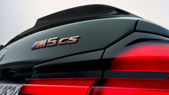 “M5 CS” model inscription BMW M5 CS F90 2021 “M5 CS” model inscription BMW M5 CS F90 2021 Frozen Deep Green metallic close-up tailgate