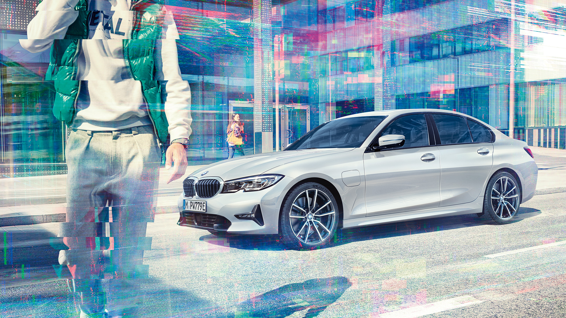 Side view BMW 3 Series Sedan BMW 330e G20 BMW 3 Series Sedan BMW 330e G20 Glaciersilver metallic side view while driving