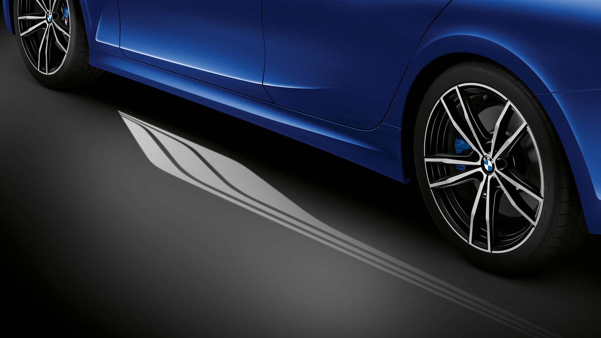 BMW 3 Series, Welcome Light Carpet Detailed side view of the open driver's door with Welcome Light Carpet.