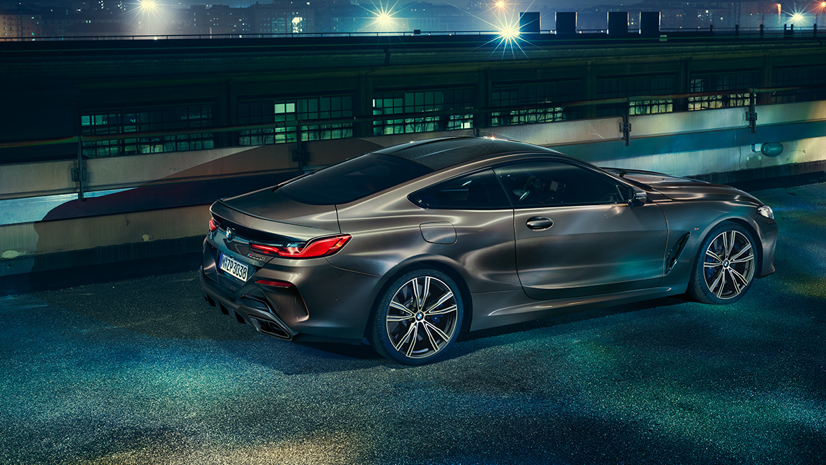 Front still shot of the BMW 8 Series Coupé. Front still shot of the BMW 8 Series Coupé with BMW Individual equipment in an urban setting at night.