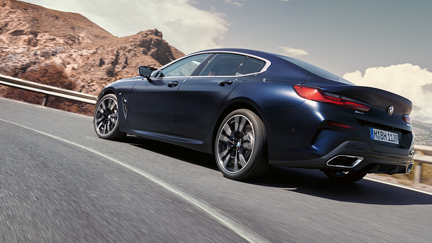 BMW 840i xDrive Gran Coupé G16 LCI Facelift 2022 driving on a mountain road BMW 840i xDrive Gran Coupé G16 LCI Facelift 2022 driving on a mountain road
