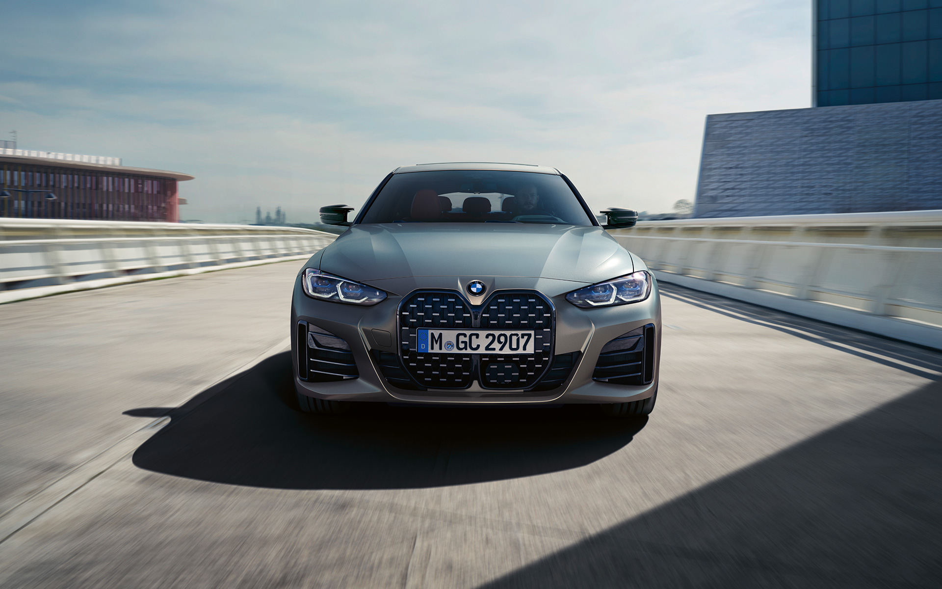 BMW M440i xDrive Gran Coupé G26 2021 Frozen Pure Grey metallic front view on the road