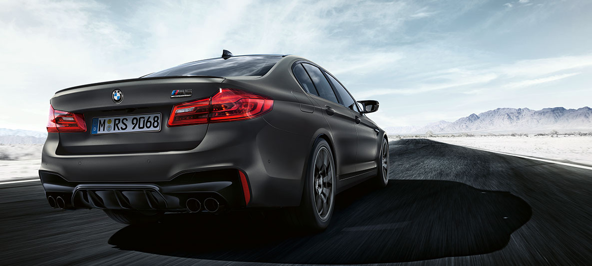 Tail pipes. BMW M5 Edition 35 Years driving shot three-quarter rear shot.