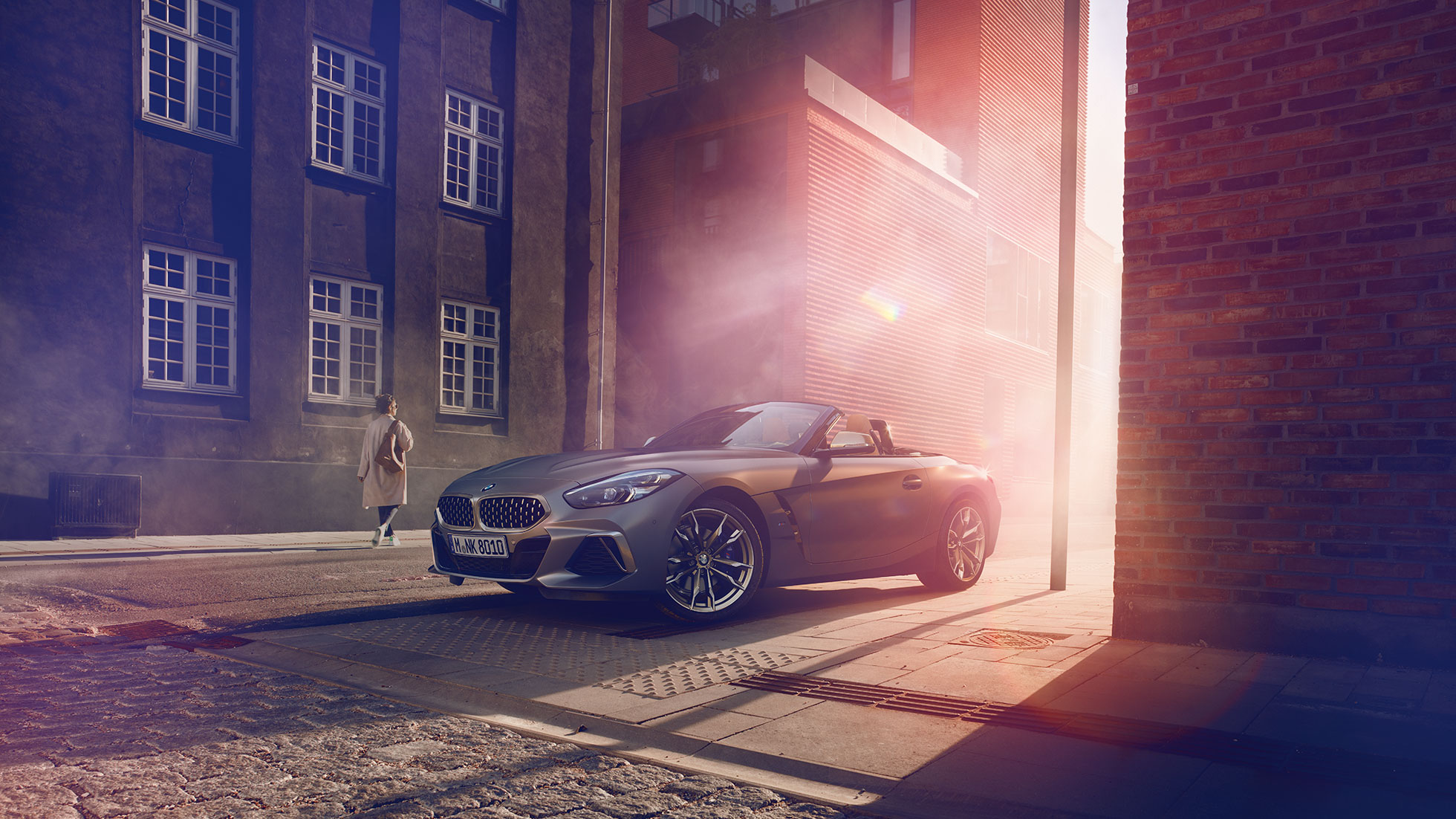 The new BMW Z4 in street Grey the new BMW Z4 in a street in front of a house